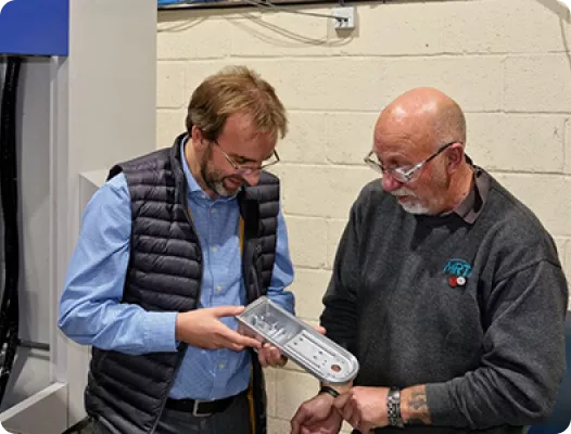 Mr. Rawnson discussing one of the first jobs to be put on the Brother SPEEDIO R650X2 machining center