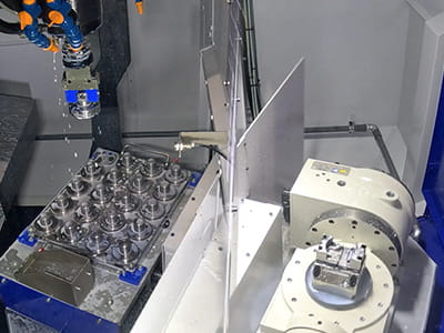 Automation using pallet changer and work gripper